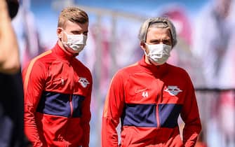 Leipzig's Slovenian midfielder Kevin Kampl (R) and Leipzig's German forward Timo Werner wear face masks as they inspect the stadium prior to the German first division Bundesliga football match RB Leipzig v SC Freiburg on May 16, 2020 in Leipzig, eastern Germany as the season resumed following a two-month absence due to the novel coronavirus COVID-19 pandemic. (Photo by Jan Woitas / POOL / AFP) / DFL REGULATIONS PROHIBIT ANY USE OF PHOTOGRAPHS AS IMAGE SEQUENCES AND/OR QUASI-VIDEO (Photo by JAN WOITAS/POOL/AFP via Getty Images)