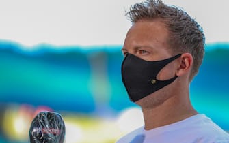 Leipzig's German headcoach Julian Nagelsmann wears a face mask as he gives an interview prior to the German first division Bundesliga football match RB Leipzig v SC Freiburg on May 16, 2020 in Leipzig, eastern Germany as the season resumed following a two-month absence due to the novel coronavirus COVID-19 pandemic. (Photo by Jan Woitas / POOL / AFP) / DFL REGULATIONS PROHIBIT ANY USE OF PHOTOGRAPHS AS IMAGE SEQUENCES AND/OR QUASI-VIDEO (Photo by JAN WOITAS/POOL/AFP via Getty Images)