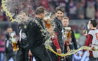 MUNICH, GERMANY - APRIL 23: head coach Julian Nagelsmann of Bayern Muenchen beer shower during the Bundesliga match between FC Bayern MÃ¼nchen and Borussia Dortmund at Allianz Arena on April 23, 2022 in Munich, Germany. (Photo by Roland Krivec/vi/DeFodi Images via Getty Images)