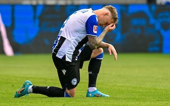Bielefeld's German midfielder Robin Hack reacts after the German first division Bundesliga football match between Arminia Bielefeld and RB Leipzig in Bielefeld, western Germany on May 14, 2022.SASCHA SCHUERMANN / AFP - DFL REGULATIONS PROHIBIT ANY USE OF PHOTOGRAPHS AS IMAGE SEQUENCES AND/OR QUASI-VIDEO (Photo by SASCHA SCHUERMANN / AFP) / DFL REGULATIONS PROHIBIT ANY USE OF PHOTOGRAPHS AS IMAGE SEQUENCES AND/OR QUASI-VIDEO (Photo by SASCHA SCHUERMANN/AFP via Getty Images)