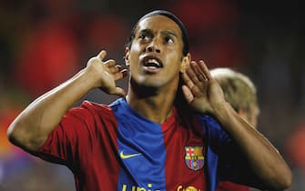 BARCELONA, SPAIN - DECEMBER 05:  Ronaldinho of Barcelona celebrates after scoring during the UEFA Champions League Group A match between Barcelona and Werder Bremen at the Nou Camp on December 5, 2006 in Barcelona, Spain.  (Photo by Shaun Botterill/Getty Images)