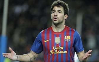 epa03097110 FC Barcelona's midfielder Cesc Fabregas celebrates after scoring the 1-0 during the King's Cup semi final return match between FC Barcelona and Valencia at the Camp Nou stadium in Barcelona, north-eastern Spain, 08 February 2012.  EPA/ANDREU DALMAU