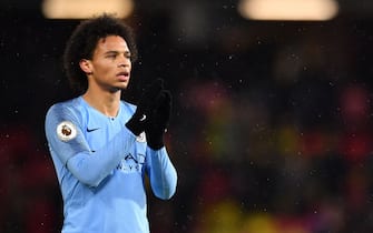 Manchester City's German midfielder Leroy Sane  celebrates following the English Premier League football match between Watford and Manchester City at Vicarage Road Stadium in Watford, north of London on December 4, 2018. (Photo by Ben STANSALL / AFP) / RESTRICTED TO EDITORIAL USE. No use with unauthorized audio, video, data, fixture lists, club/league logos or 'live' services. Online in-match use limited to 120 images. An additional 40 images may be used in extra time. No video emulation. Social media in-match use limited to 120 images. An additional 40 images may be used in extra time. No use in betting publications, games or single club/league/player publications. /         (Photo credit should read BEN STANSALL/AFP/Getty Images)