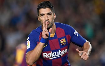 Barcelona's Uruguayan forward Luis Suarez celebrates acoring the opening goal during the Spanish league football match between FC Barcelona and Sevilla FC at the Camp Nou stadium in Barcelona on October 6, 2019. (Photo by Josep LAGO / AFP) (Photo by JOSEP LAGO/AFP via Getty Images)