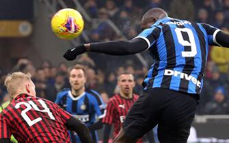 ITALY SOCCER SERIE A epa08206745 Inter Milans Romelu Lukaku (R) scores against AC Milan's Simon Kjaer during the Italian Serie A soccer match between Inter Milan and AC Milan at the Giuseppe Meazza Stadium in Milan, Italy, 09 February 2020. Inter won 4-2. EPA/MATTEO BAZZI