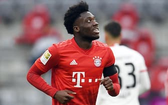 epa08440004 Bayern Munich's Alphonso Davies celebrates scoring during the German Bundesliga soccer match Bayern Munich vs Eintracht Frankfurt in Munich, Germany, 23 May 2020. The German Bundesliga is the world's first major soccer league to resume after a two-month suspension because of the Coronavirus pandemic.  EPA/ANDREAS GEBERT / POOL DFL regulations prohibit any use of photographs as image sequences and/or quasi-video.