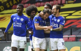 epa08497634 Ben Chilwell (C) of Leicester celebrates with teammates after scoring the 1-0 lead during the English Premier League soccer match between Watford FC and Leicester City in Watford, Britain, 20 June 2020.  EPA/ANDY RAIN / NMC / EPA POOL EDITORIAL USE ONLY. No use with unauthorized audio, video, data, fixture lists, club/league logos or 'live' services. Online in-match use limited to 120 images, no video emulation. No use in betting, games or single club/league/player publications.
