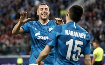 epa07890504 Vyacheslav Karavaev and Artem Dzyuba (L) of Zenit celebrate after Benfica scored an own goal during the UEFA Champions League match between Zenit St.Petersburg and SL Benfica in St.Petersburg, Russia, 02 October 2019.  EPA/ANATOLY MALTSEV
