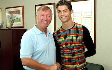 MANCHESTER, ENGLAND - AUGUST 12: Sir Alex Ferguson greets Cristiano Ronaldo as the young Portugese player signs for Manchester united at the Carrington Training Ground, Carrington on August 12, 2003 in Manchester, England. (Photo by John Peters/Manchester United via Getty Images)