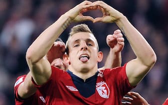Lille's French defender Lucas Digne makes a heart shape with his hands after scoring a goal during their French L1 football match Lille vs Lorient, on April 7, 2013 at the Grand Stade, in Lille, northern France. AFP PHOTO DENIS CHARLET        (Photo credit should read DENIS CHARLET/AFP via Getty Images)