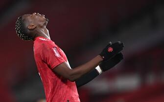 epa08962819 Paul Pogba of Manchester United reacts during the English FA Cup fourth round soccer match between Manchester United and Liverpool in Manchester, Britain, 24 January 2021.  EPA/Laurence Griffiths / POOL EDITORIAL USE ONLY. No use with unauthorized audio, video, data, fixture lists, club/league logos or 'live' services. Online in-match use limited to 120 images, no video emulation. No use in betting, games or single club/league/player publications.