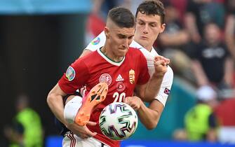 epa09285564 Roland Sallai (front) of Hungary in action against Benjamin Pavard of France during the UEFA EURO 2020 group F preliminary round soccer match between Hungary and France in Budapest, Hungary, 19 June 2021.  EPA/Tibor Illyes / POOL (RESTRICTIONS: For editorial news reporting purposes only. Images must appear as still images and must not emulate match action video footage. Photographs published in online publications shall have an interval of at least 20 seconds between the posting.)