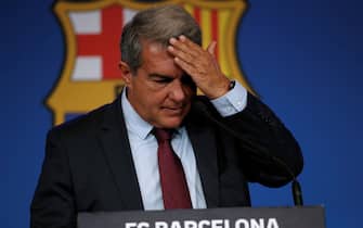 epa09399909 Barcelona's FC President Joan Laporta addresses a press conference to explain the reason why Argentine forward Lionel Messi will not extend his contract with the team in Barcelona, Spain, 06 August 2021. FC Barcelona issued a statement on 05 August announcing Argentinian striker Lionel Messi will not extend his contract with the team due to 'economic and structural obstacles'.  EPA/ALEJANDRO GARCIA