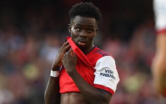 epa09490125 Bukayo Saka of Arsenal reacts during the English Premier League soccer match between Arsenal FC and Tottenham Hotspur in London, Britain, 26 September 2021.  EPA/Facundo Arrizabalaga EDITORIAL USE ONLY. No use with unauthorized audio, video, data, fixture lists, club/league logos or 'live' services. Online in-match use limited to 120 images, no video emulation. No use in betting, games or single club/league/player publications