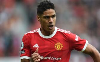 epa09487090 Raphael Varane of Manchester United in action during the English Premier League soccer match between Manchester United and Aston Villa in Manchester, Britain, 25 September 2021.  EPA/Peter Powell EDITORIAL USE ONLY. No use with unauthorized audio, video, data, fixture lists, club/league logos or 'live' services. Online in-match use limited to 120 images, no video emulation. No use in betting, games or single club/league/player publications