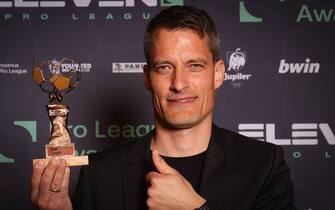 Pro League Coach of the year, Oostende's head coach Alexander Blessin poses with the trophy at the Pro League Awards 2021, for the best players in the 1st and 2nd (1b) divisions of the Belgian soccer championships, Monday 24 May 2021 in Brussels. BELGA PHOTO VIRGINIE LEFOUR (Photo by VIRGINIE LEFOUR/BELGA MAG/AFP via Getty Images)