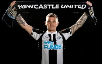 NEWCASTLE UPON TYNE, ENGLAND - JANUARY 05: In this image released on January 7, Kieran Trippier poses for photographs with a scarf at the Newcastle United Training Centre on January 05, 2022 in Newcastle upon Tyne, England. (Photo by Serena Taylor/Newcastle United via Getty Images)