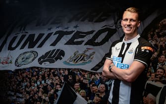 NEWCASTLE UPON TYNE, ENGLAND - JANUARY 31: New Newcastle United signing Dan Burn poses for photographs at St.James' Park on January 31, 2022 in Newcastle upon Tyne, England. (Photo by Serena Taylor/Newcastle United via Getty Images)
