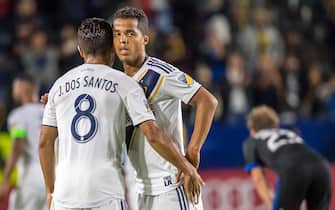CARSON, CA - MAY 25: Jonathan dos Santos #8 and Giovani dos Santos #10 of Los Angeles Galaxy during the Los Angeles Galaxy's MLS match against San Jose Earthquakes at the StubHub Center on May 25, 2018 in Carson, California.  The Los Angeles Galaxy won the match 1-0 (Photo by Shaun Clark/Getty Images)