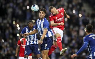 epa09655440 FC Porto's Fabio Cardoso (L) in action against Benfica's Seferovic (R) during their Portuguese Cup soccer match held at Dragao stadium, Porto, Portugal, 23 December 2021.  EPA/JOSE COELHO