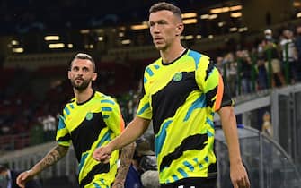 MILAN, ITALY - SEPTEMBER 15: Ivan Perisic and Marcelo Brozovic of FC Internazionale run onto the pitch before the UEFA Champions League group D match between Inter and Real Madrid at Giuseppe Meazza Stadium on September 15, 2021 in Milan, Italy. (Photo by Mattia Ozbot - Inter/Inter via Getty Images)