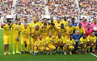 Team R10 with Brazilian football player Ronaldinho (3rd L) pose for a photo during "The Beautiful Game" a celebrity football match at DRV PNK stadium in Fort Lauderdale, Florida on June 18, 2022. (Photo by CHANDAN KHANNA / AFP) (Photo by CHANDAN KHANNA/AFP via Getty Images)