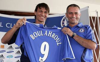 COBHAM, UNITED KINGDOM - AUGUST 22:  New signing Khalid Boulahrouz of Chelsea poses for the cameras with manager Jose Mourinho during the Chelsea Press Conference at the Chelsea Training Ground on August 22, 2006 in Cobham, England.  (Photo by Christopher Lee/Getty Images)