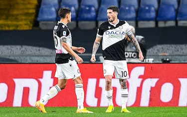 GENOA, ITALY - MARCH 13: Rodrigo De Paul of Udinese (R) celebrates with his team-mate Nahuel Molina after scoring a goal on a penalty kick during the Serie A match between Genoa CFC and Udinese Calcio at Stadio Luigi Ferraris on March 13, 2021 in Genoa, Italy. (Photo by Paolo Rattini/Getty Images)