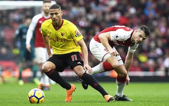 epa06596381 Arsenal's Granit Xhaka (R) in action against Watford's Richarlison (L) during the English Premier League soccer match between Arsenal FC and Watford FC in London, Britain, 11 March 2018.  EPA/WILL OLIVER EDITORIAL USE ONLY. No use with unauthorized audio, video, data, fixture lists, club/league logos or 'live' services. Online in-match use limited to 75 images, no video emulation. No use in betting, games or single club/league/player publications