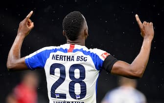 epa08438326 Dodi Lukebakio of Hertha Berlin celebrates after scoring during the German Bundesliga soccer match between Hertha BSC and 1. FC Union Berlin at Olympiastadion in Berlin, Germany, 22 May 2020. The Bundesliga and Second Bundesliga is the first professional league to resume the season after the nationwide lockdown due to the ongoing Coronavirus (COVID-19) pandemic. All matches until the end of the season will be played behind closed doors.  EPA/Stuart Franklin / POOL DFL regulations prohibit any use of photographs as image sequences and/or quasi-video.