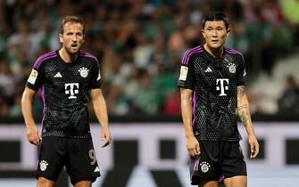 BREMEN, GERMANY - AUGUST 18: (L-R) Harry Kane and Min-jae Kim of Bayern look on during the Bundesliga match between SV Werder Bremen and FC Bayern MÃ¼nchen at Wohninvest Weserstadion on August 18, 2023 in Bremen, Germany. (Photo by Christof Koepsel/Getty Images)