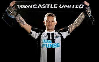 NEWCASTLE UPON TYNE, ENGLAND - JANUARY 05: In this image released on January 7, Kieran Trippier poses for photographs with a scarf at the Newcastle United Training Centre on January 05, 2022 in Newcastle upon Tyne, England. (Photo by Serena Taylor/Newcastle United via Getty Images)