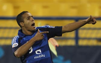 Saudi Arabia's Al-Hilal Moroccan player Yousef Al-Arabi celebrates after scoring against Qatar's Al-Gharafa club during their Group D AFC Championship League football match in Doha on March 21, 2012.   AFP PHOTO/STR (Photo credit should read STR/AFP via Getty Images)