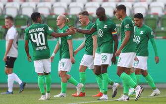 FUERSTENWALDE, GERMANY - SEPTEMBER 12: Josuha Guilavogui #23 of Wolfsburg celebrates his team's fourth goal with teammates during the DFB Cup first round match between FSV Union FÃ¼rstenwalde and VfL Wolfsburg at Sportpark-Karl-Friedrich-Friesen on September 12, 2020 in Fuerstenwalde, Germany. (Photo by Martin Rose/Getty Images)