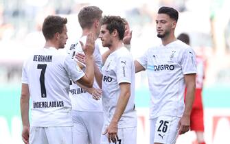 MOENCHENGLADBACH, GERMANY - SEPTEMBER 12: Jonas Hofmann of Moenchengladbach celebrates his team's first goal with teammates during the DFB Cup first round match between FC Oberneuland and Borussia MÃ¶nchengladbach at Borussia-Park on September 12, 2020 in Moenchengladbach, Germany. (Photo by Lars Baron/Getty Images)