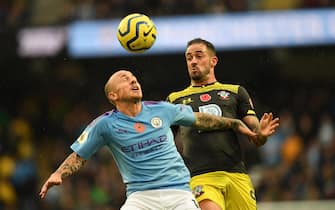 epa07967193 Manchester City's Angelino (L) vies for the ball against Southampton's Danny Ings (R)  during the English Premier League soccer match between Manchester City v Southampton at the Etihad stadium in Manchester, Britain, 02 November 2019.  EPA/FACUNDO ARRIZABALAGA EDITORIAL USE ONLY. No use with unauthorized audio, video, data, fixture lists, club/league logos or 'live' services. Online in-match use limited to 120 images, no video emulation. No use in betting, games or single club/league/player publications