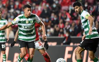 Matheus Nunes of Sporting challenges for the ball during the Liga Portugal Bwin match between SL Benfica and Sporting CP at Estadio da Luz on December 3, 2021 in Lisbon, Portugal.