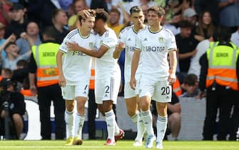 Leeds United's Brenden Aaronson (left) celebrates scoring their side's first goal of the game during the Premier League match at Elland Road, Leeds. Picture date: Sunday August 21, 2022.