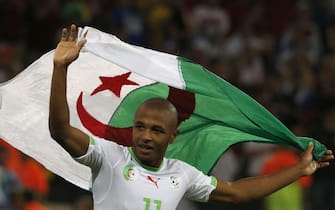 epa04284563 Yacine Brahimi of Algeria celebrates after the FIFA World Cup 2014 group H preliminary round match between Algeria and Russia at the Arena da Baixada in Curitiba, Brazil, 26 June 2014. (RESTRICTIONS APPLY: Editorial Use Only, not used in association with any commercial entity - Images must not be used in any form of alert service or push service of any kind including via mobile alert services, downloads to mobile devices or MMS messaging - Images must appear as still images and must not emulate match action video footage - No alteration is made to, and no text or image is superimposed over, any published image which: (a) intentionally obscures or removes a sponsor identification image; or (b) adds or overlays the commercial identification of any third party which is not officially associated with the FIFA World Cup)  EPA/RUNGROJ YONGRIT   EDITORIAL USE ONLY