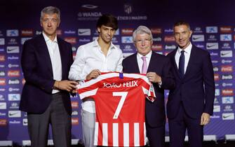SPAIN SOCCER epa07703257 Portuguese player Joao Felix (2-L) poses for photographs with (from left) Atletico Madrid's Managing Director, Miguel Angel Gil Marin; club's President, Enrique Cerezo, and team's Sport Director, Andrea Berta, during his presentation as new Atletico Madrid player at Wanda Metropolitano Stadium, in Madrid, Spain, 08 July 2019. The 19-year-old Felix came from Portuguese side SL Benfica. EPA/Juan Carlos Hidalgo