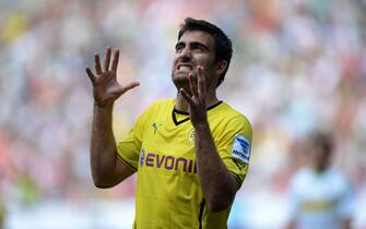 Dortmund's defender Sokratis reacts during the Telekom Cup football match Borussia Moenchengladbach vs Borussia Dortmund in the German city of Moenchengladbach on July 20, 2013. AFP PHOTO / PATRIK STOLLARZ

DFL RULES TO LIMIT THE ONLINE USAGE DURING MATCH TIME TO 15 PICTURES PER MATCH. IMAGE SEQUENCES TO SIMULATE VIDEO IS NOT ALLOWED AT ANY TIME. FOR FURTHER QUERIES PLEASE CONTACT DFL DIRECTLY AT + 49 69 650050.        (Photo credit should read PATRIK STOLLARZ/AFP/Getty Images)