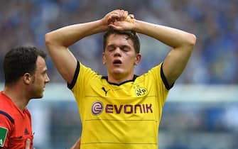 Dortmund's defender Matthias Ginter reacts during the German Bundesliga first division football match between FC Schalke 04 and Borussia Dortmund, in the Veltins Arena in Gelsenkirchen, western Germany , on April 10, 2016.  / AFP / PATRIK STOLLARZ / RESTRICTIONS: DURING MATCH TIME: DFL RULES TO LIMIT THE ONLINE USAGE TO 15 PICTURES PER MATCH AND FORBID IMAGE SEQUENCES TO SIMULATE VIDEO. == RESTRICTED TO EDITORIAL USE == FOR FURTHER QUERIES PLEASE CONTACT DFL DIRECTLY AT + 49 69 650050        (Photo credit should read PATRIK STOLLARZ/AFP/Getty Images)