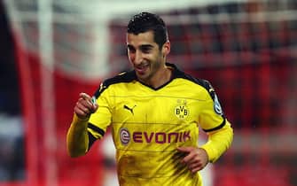 STUTTGART, GERMANY - FEBRUARY 09:  Henrikh Mkhitaryan of Borussia Dortmund celebrates as he scores their third goal during the DFB Cup Quarter Final match between VfB Stuttgart and Borussia Dortmund at Mercedes-Benz Arena on February 9, 2016 in Stuttgart, Germany.  (Photo by Alex Grimm/Bongarts/Getty Images)
