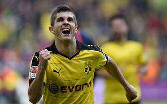 Dortmund's midfielder Christian Pulisic celebrates scoring the 1-0 goal during the German Bundesliga first division football match BVB Borussia Dortmund vs Hamburg SV in Dortmund, western Germany, on April 17, 2016. 

 / AFP / PATRIK STOLLARZ / RESTRICTIONS: DURING MATCH TIME: DFL RULES TO LIMIT THE ONLINE USAGE TO 15 PICTURES PER MATCH AND FORBID IMAGE SEQUENCES TO SIMULATE VIDEO. == RESTRICTED TO EDITORIAL USE == FOR FURTHER QUERIES PLEASE CONTACT DFL DIRECTLY AT + 49 69 650050
        (Photo credit should read PATRIK STOLLARZ/AFP/Getty Images)