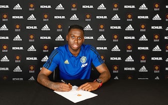 MANCHESTER, ENGLAND - JUNE 29: Aaron Wan-Bissaka of Manchester United poses after signing for the club at Aon Training Complex on June 29, 2019 in Manchester, England. (Photo by Manchester United/Manchester United via Getty Images)