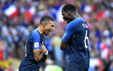 MOSCOW, RUSSIA - JULY 15:  Kylian Mbappe of France celebrates with team mate Paul Pogba after scoring his team's fourth goal during the 2018 FIFA World Cup Final between France and Croatia at Luzhniki Stadium on July 15, 2018 in Moscow, Russia.  (Photo by Michael Regan - FIFA/FIFA via Getty Images)