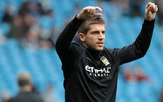 epa03407980 Manchester City substitute Matija Nastasic warms-up prior to their English Premie League soccer match at the Etihad Airways stadium in Manchester, Britain 23 September 2012. 
DataCo terms and conditions apply http//www.epa.eu/downloads/DataCo-TCs.pdf  EPA/LINDSEY PARNABY