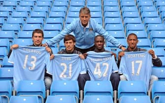 epa02275691 Manager Roberto Mancini (C-back) of English Barclays Premier League soccer team Manchester City FC with new players (front L-R) Aleksandar Kolarov, David Silva, Yaya Toure and Jerome Boateng during an open training session at the City of Manchester Stadium, Manchester, north west England on 06 August 2010.  EPA/NICK WILKINSON
