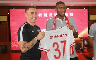 TIANJIN, CHINA - JULY 17:  Tianjin Quanjian manager Fabio Cannavaro (L) and French footballer Anthony Modeste pose at a press conference of Tianjin Quanjian FC on July 17, 2017 in Tianjin, China. Anthony Modeste plays for Tianjin Quanjian in the 2017 Chinese Super League (CSL) matches.  (Photo by Visual China Group via Getty Images/Visual China Group via Getty Images)