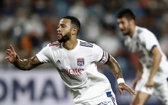 epa08671649 Olympique Lyon's Memphis Depay celebrates a goal during the soccer Ligue 1 match between Montpellier HSC and Olympique Lyon at La Mosson stadium, Montpellier, France, 15 September 2020.  EPA/Guillaume Horcajuelo